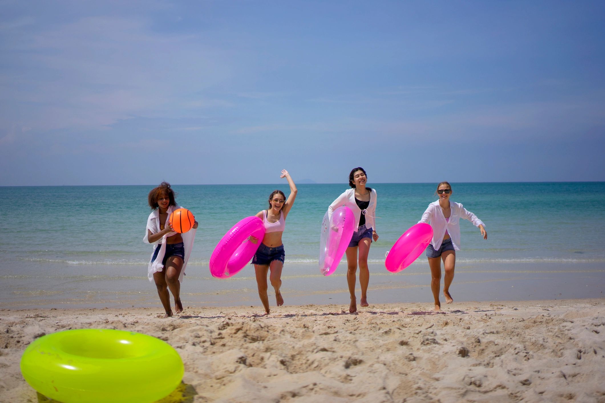Friends enjoying group travel on the beach